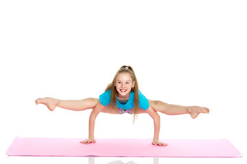 girl gymnast performs a handstand.