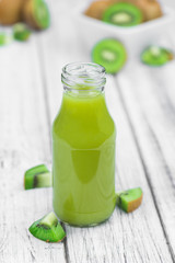 Vintage wooden table with fresh made Kiwi Smoothies