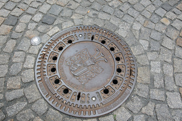 An old sewer manhole cover