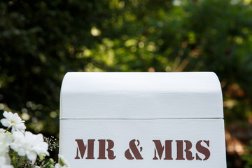 Love and relationship. Inscription Mr and Mrs on white wooden background. Wedding and marriage concept
