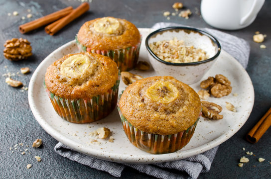 Banana muffins with cinnamon on a concrete background