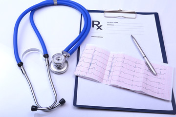 RX prescription, pen and a stethoscope isolated on white background