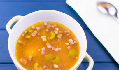 Soup of saltwort. Soup from different types of sausages, olives, potatoes, tomato paste.