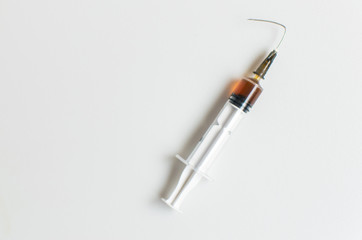 Syringe with a bent needle. The concept is no drugs.