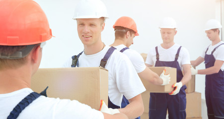 team of builders to unload materials