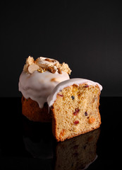 Easter cake with raisins and candied fruits in white glaze, cut