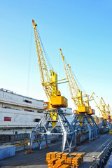 Fototapeta na wymiar Port cargo crane, train and metal