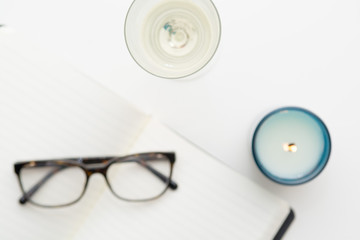 Keeping a diary, and writing a journal overhead of white desk