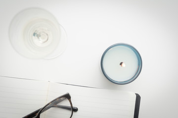Keeping a diary, and writing a journal overhead of white desk