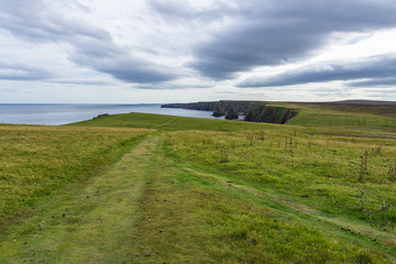 Fototapeta na wymiar Duncansby Head landscape with cliffs and sea stack in the foreground, Caithness, Scotland, Britain