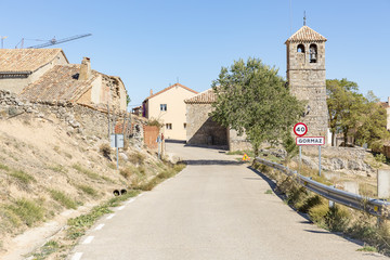 Fototapeta na wymiar paved road passing through Gormaz village, province of Soria, Spain
