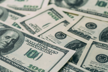 Dollars background, heap of hundred USA dollar banknote bills, many American cash money