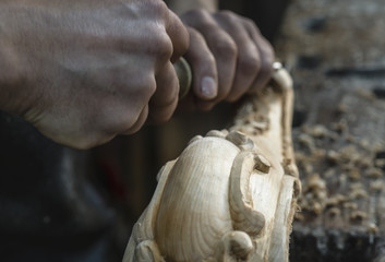 Artisan carve wood