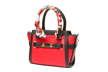 red female bag with black handles, decoration on the handle, isolated on white background