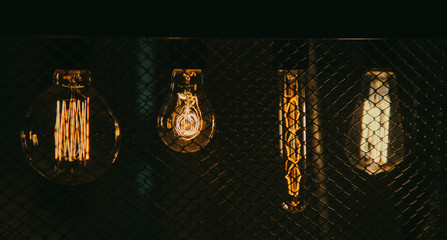 Edison vintage retro light bulb lamp lantern at dark. Art detail decor of interior