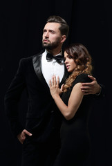portrait of fashion couple on black background