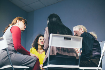 Different aged people overcame drug addiction and having group session. Help concept. Toned .