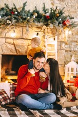 Young family in Christmas interior