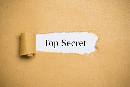 torn up paper revealing "top secret"