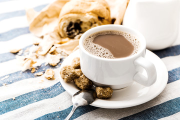 Cappuccino on a striped tablecloth. Morning coffee.