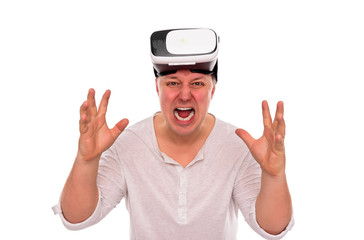 Naklejka premium Angry man with glasses or a helmet of virtual reality on his head on a white.