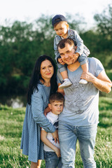 Fototapeta premium Family Dad Mom and Children in the Field