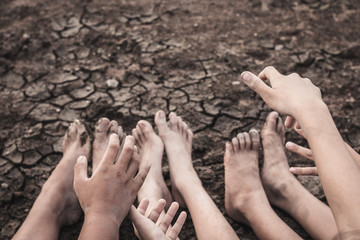 Drought caused by water shortage close up hand and foot.