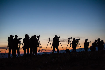 A group of photographers waitting for sunrise in outside