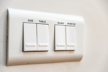 Close up view light switches with name Table on it