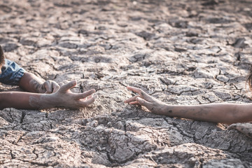 The cracked dry ground due to drought, food shortages and water,  Concept drought and crisis environment.