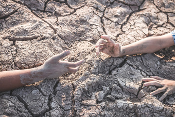 The cracked dry ground due to drought, food shortages and water,  Concept drought and crisis environment.