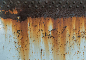 Metal rust texture with rivets, abstract grunge background