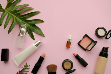 cosmetic makeup flat lay pink background.