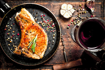 Grilled pork steak with red wine.