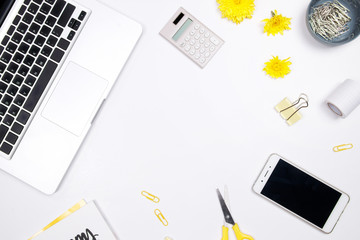 Woman workspace with laptop, handwritten quote notebook, yellow flower and smartphone on white background. Flat lay, top view. stylish female blogger concept. spring summer background.