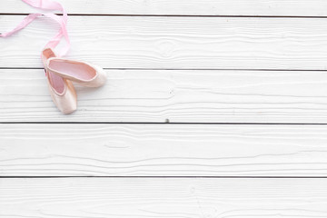 Professional dance shoes. Ballet concept. Pointes on white wooden background top view copy space