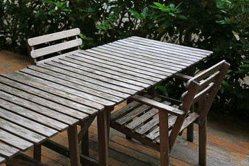 Empty wooden table and chair in the garden.