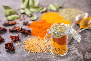 Spices on a gray concrete background. Selective focus.  Copy space