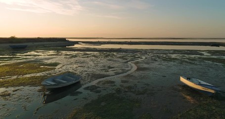 Dawn aerial panoramic seascape view of Olhao salt marsh Inlet, waterfront to Ria Formosa natural park. Portugal.