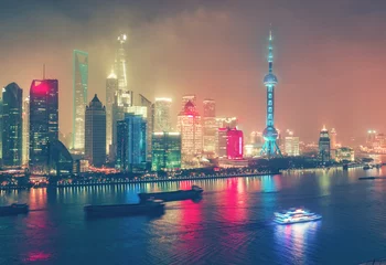 Sierkussen Aerial view on big modern city by night. Shangai, China. Nighttime skyline with illuminated skyscrapers. © Funny Studio