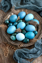 Fototapeta na wymiar Colorful easter eggs on metal plate