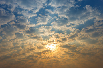 Beautiful fluffy clouds with evening sunset background.
