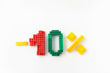 Obraz premium price reduction in percent. a discount. figures from a colored cubes designer on a white background.