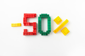 price reduction in percent. a discount. figures from a colored cubes designer on a white background.