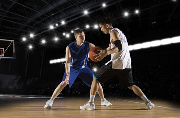 Two basketball players in action