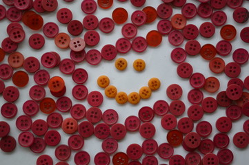 Smiley face red and yellow in buttons, background