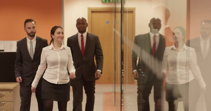 Group of multi-ethnic businessmen arrive to a business meeting.