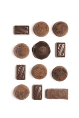 Assorted chocolate candies on white