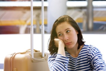 Stress woman passenger at the airport.  She is up set .