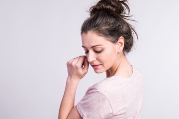 Portrait of a young beautiful woman in studio.